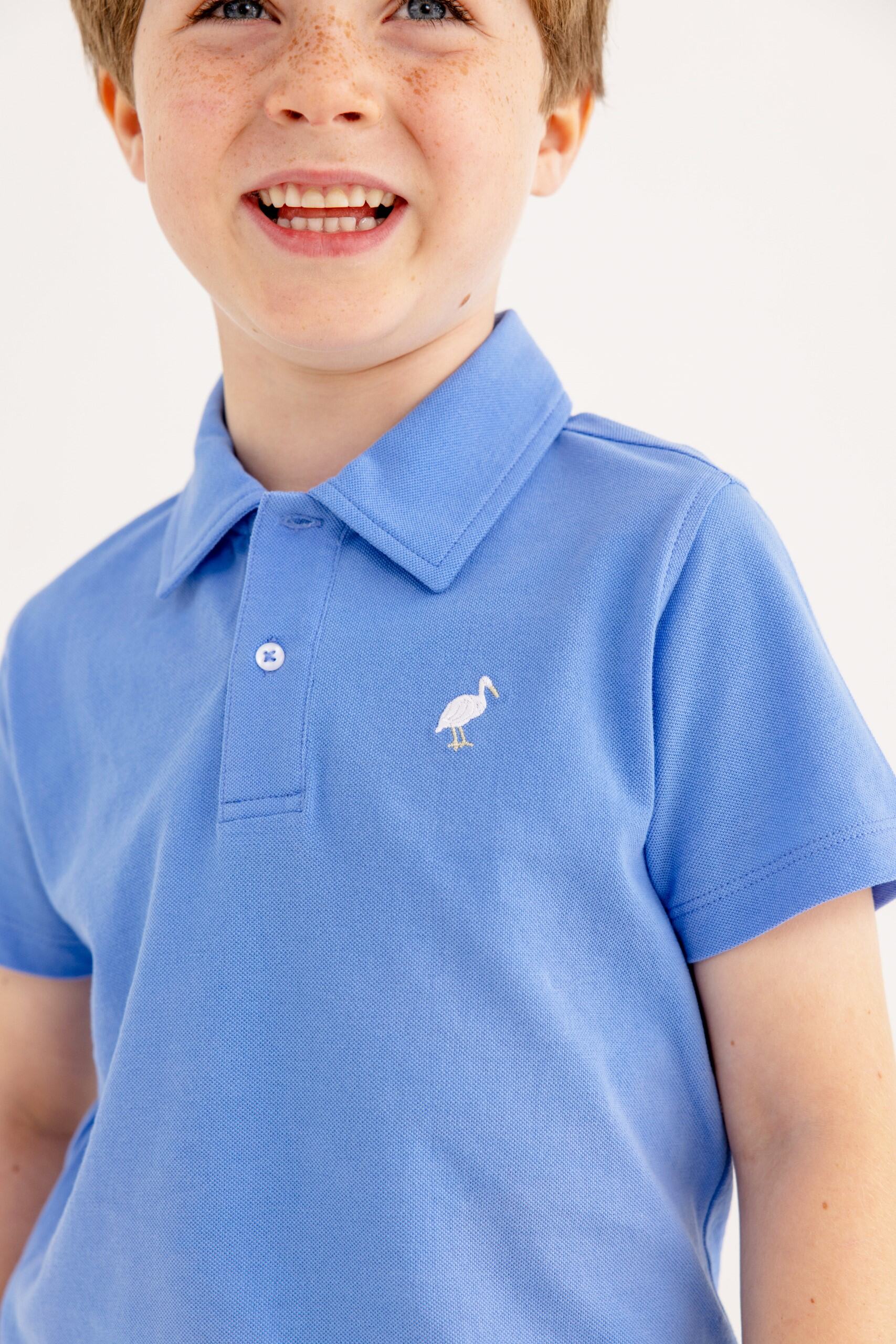 TBBC SS Prim & Proper Beach Polo: Sunrise Blvd Blue w/Multicolor Stork