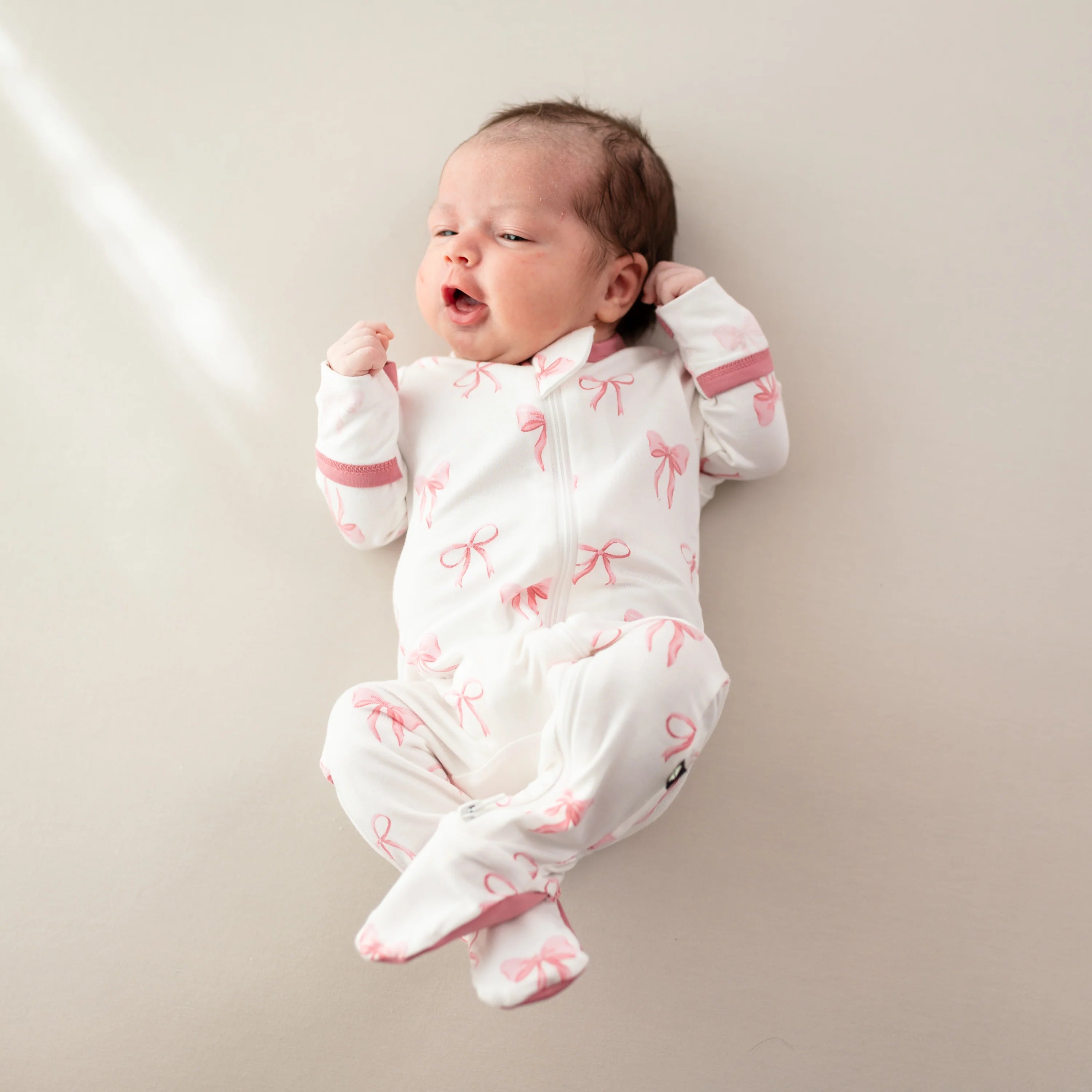 Kyte Baby Zippered Footie: Bow