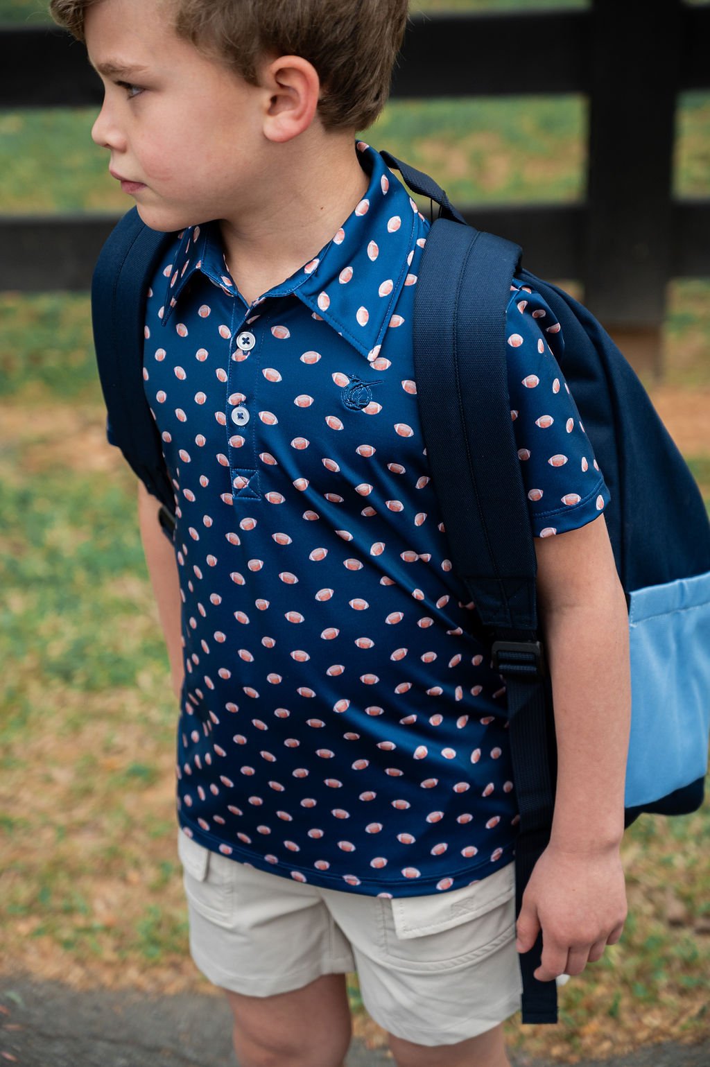 Boys SS Performance Polo: Dark Denim with Footballs
